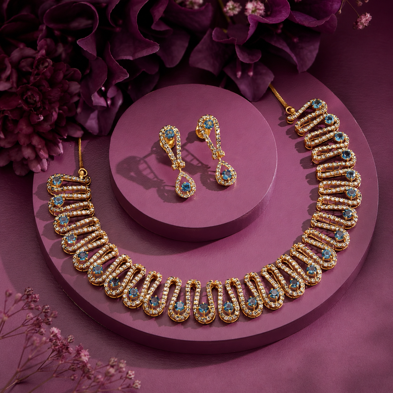 ChatGPT Image Jul 3, 2026, 01_42_41 PM Royal gold-plated artificial necklace set featuring sparkling cubic zirconia and royal blue stones with matching drop earrings